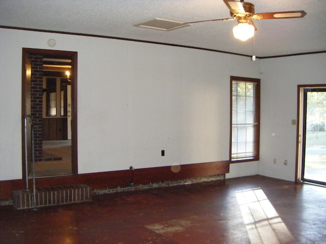 unfurnished room with ceiling fan, crown molding, and a textured ceiling