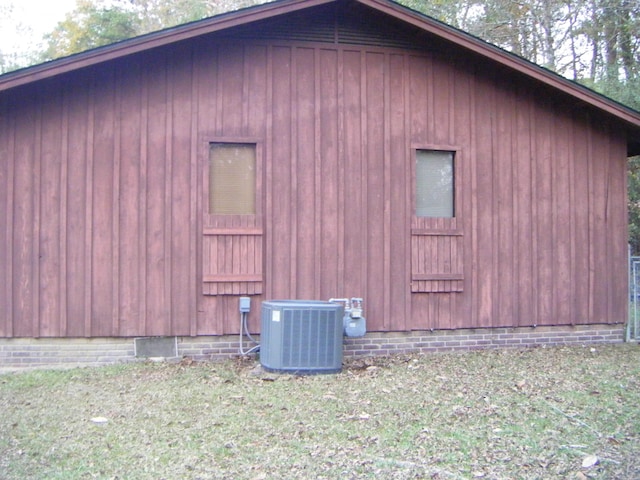 view of side of home featuring central AC