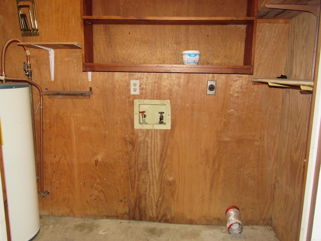 laundry room featuring hookup for an electric dryer, wooden walls, hookup for a washing machine, and water heater