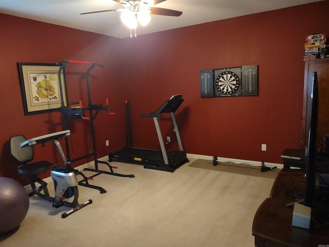 workout area featuring ceiling fan and light carpet