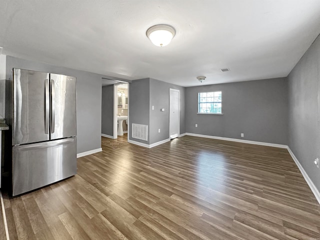 unfurnished living room featuring wood-type flooring