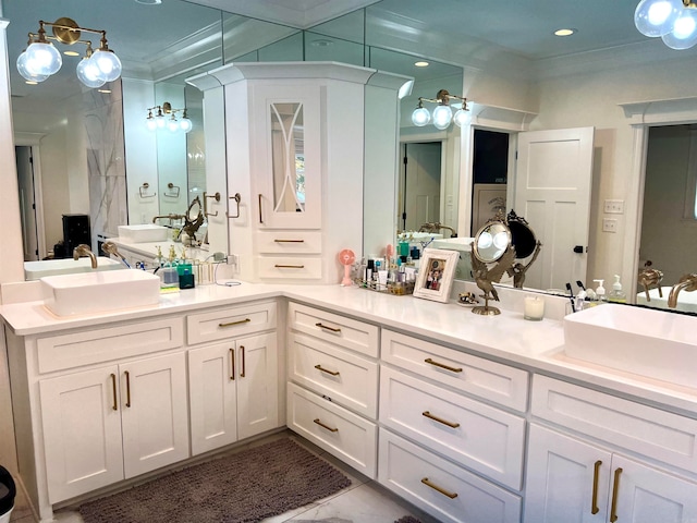 bathroom with crown molding and vanity