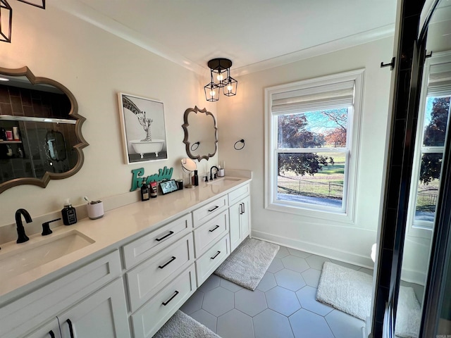 bathroom featuring tile patterned floors, vanity, ornamental molding, and a shower with door