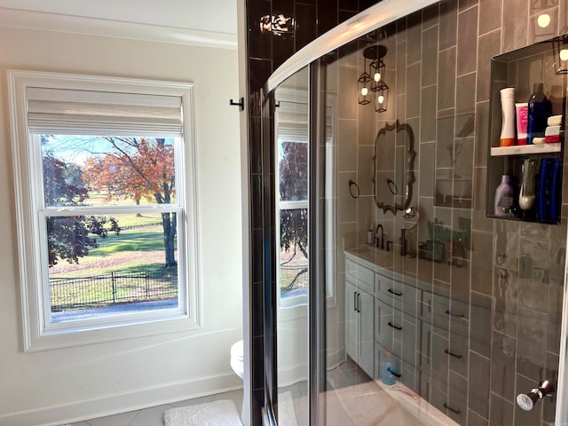 bathroom with toilet, tile patterned flooring, and walk in shower