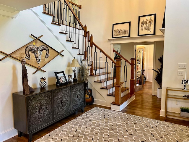 stairway with hardwood / wood-style floors