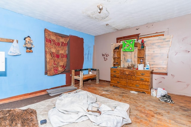 bedroom with wood-type flooring