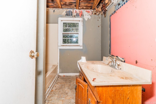 bathroom with vanity and a tub to relax in