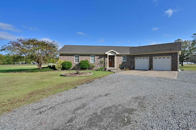 single story home with a garage and a front lawn