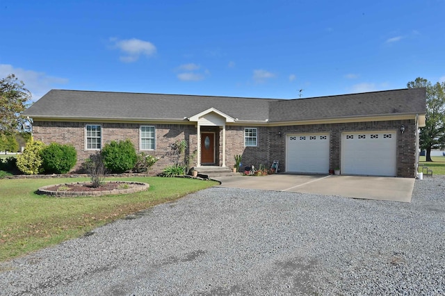 single story home featuring a garage and a front lawn