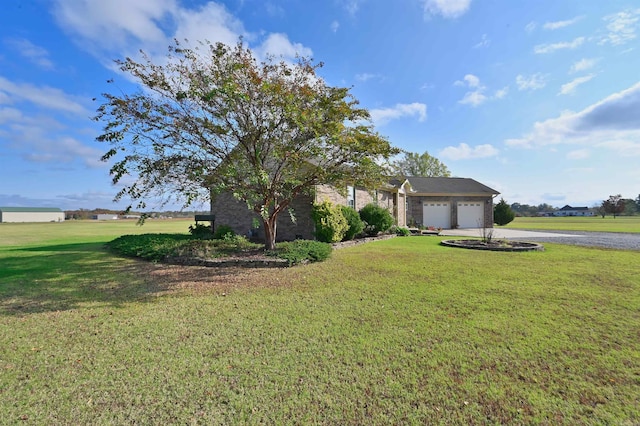 view of front of property with a garage and a front yard