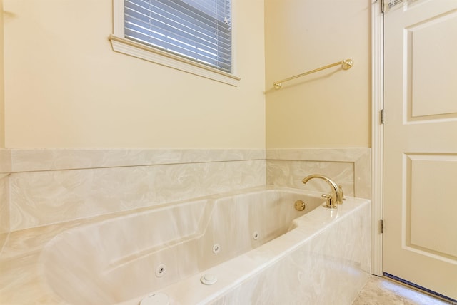 bathroom featuring tiled tub