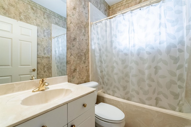 full bathroom featuring shower / bath combo with shower curtain, vanity, and toilet