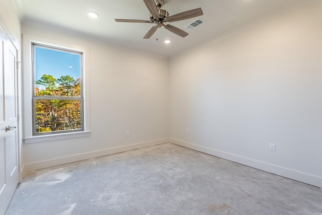 empty room with ceiling fan and ornamental molding