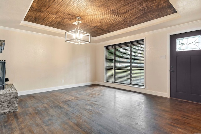 entryway featuring dark hardwood / wood-style floors, wooden ceiling, ornamental molding, and a tray ceiling