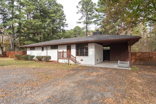 view of front of house with a carport