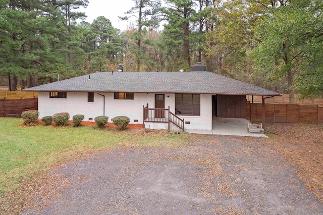 ranch-style house featuring a patio area and a front lawn