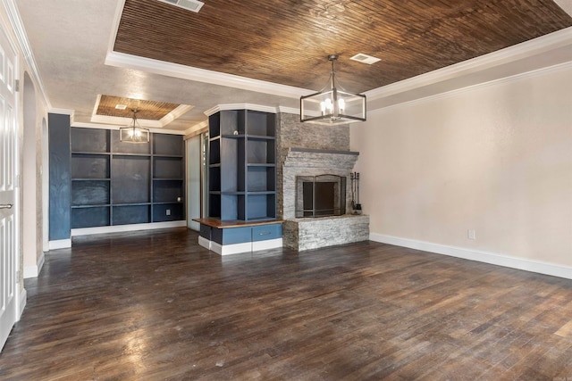 unfurnished living room with a raised ceiling, dark hardwood / wood-style floors, crown molding, a fireplace, and wood ceiling