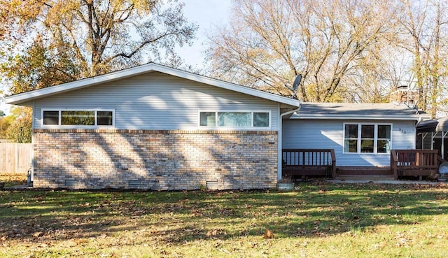 view of property exterior featuring a yard and a wooden deck