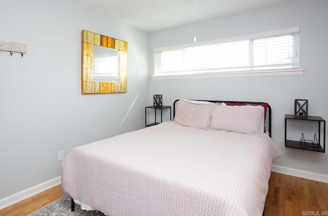 bedroom featuring hardwood / wood-style floors