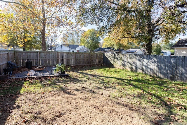 view of yard with an outdoor fire pit