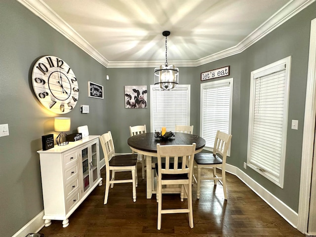 dining area with ornamental molding, dark wood-type flooring, and an inviting chandelier