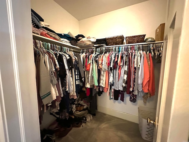 walk in closet featuring carpet floors