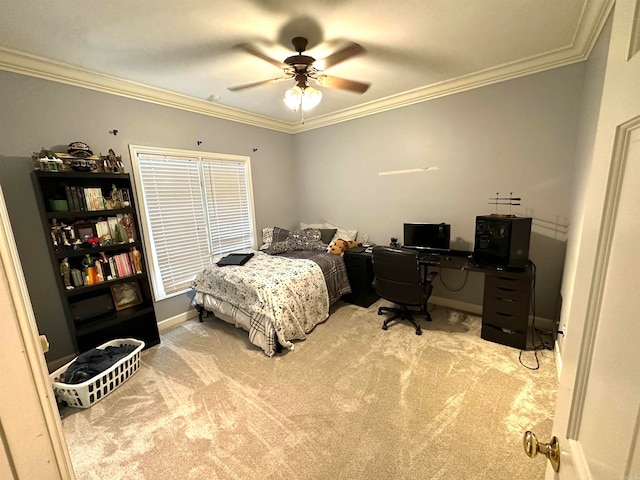 carpeted bedroom with ceiling fan and ornamental molding