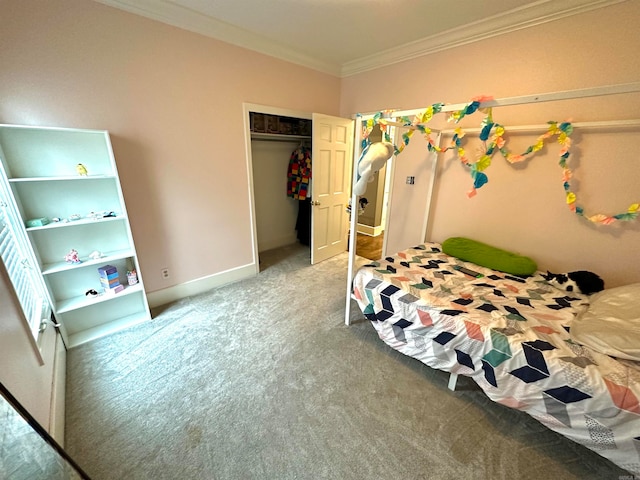 carpeted bedroom featuring ornamental molding and a closet