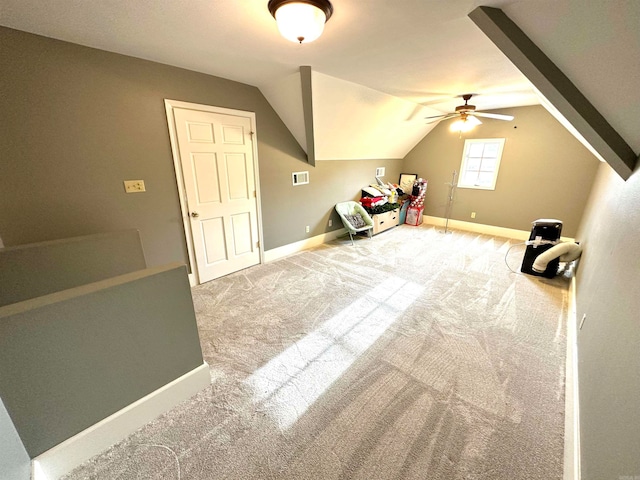 additional living space featuring carpet flooring, vaulted ceiling, and ceiling fan