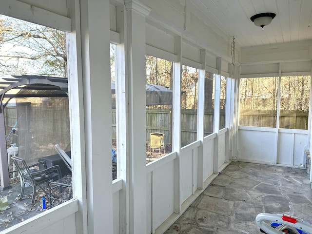 unfurnished sunroom with a wealth of natural light