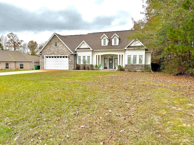 view of front of home featuring a front yard and a garage