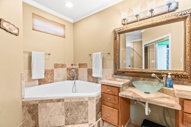 bathroom featuring a relaxing tiled tub, ornamental molding, and sink