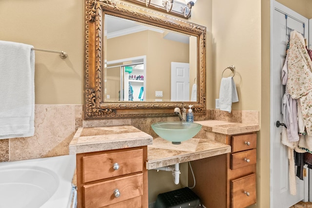 bathroom featuring vanity and ornamental molding