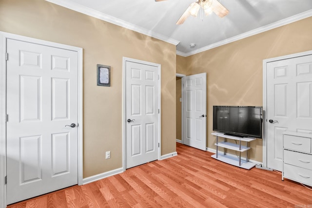 unfurnished bedroom featuring light hardwood / wood-style floors, ceiling fan, and ornamental molding