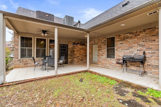 exterior space featuring area for grilling and ceiling fan