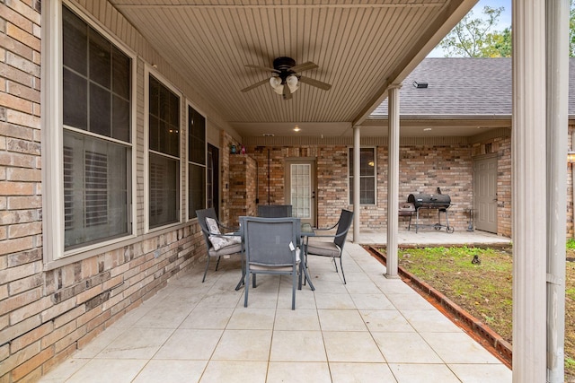 view of patio with ceiling fan and a grill