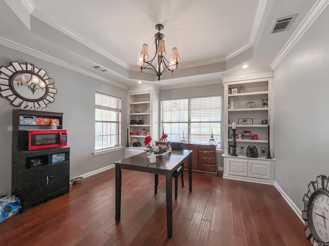 office area with dark hardwood / wood-style flooring, an inviting chandelier, and ornamental molding