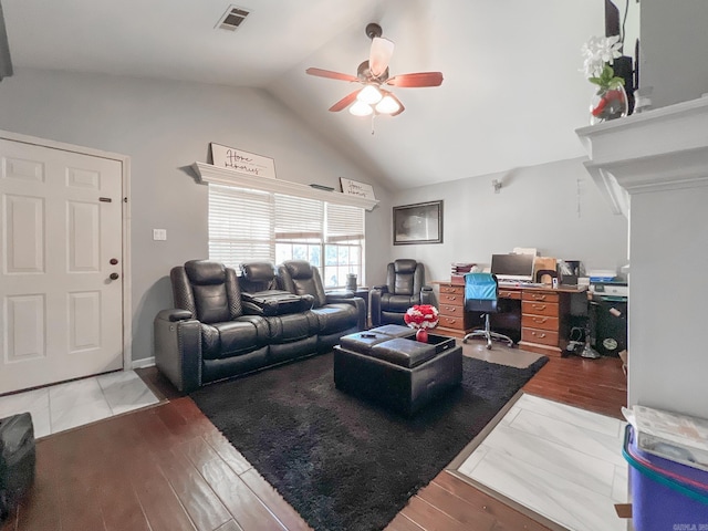 living room featuring ceiling fan, light hardwood / wood-style floors, and lofted ceiling