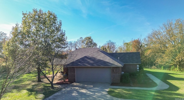 view of front facade with a front lawn and a garage