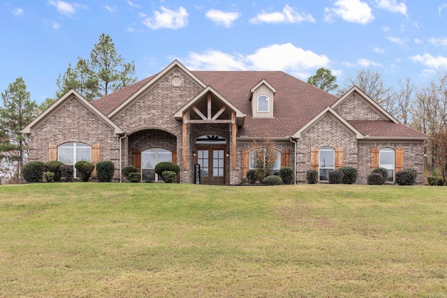 view of front of property featuring french doors and a front yard