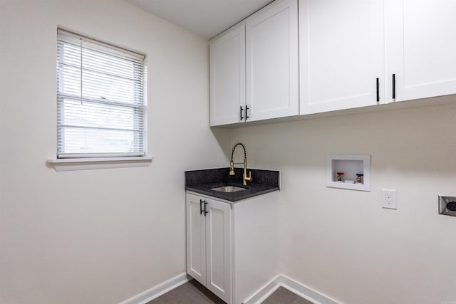 washroom with cabinets, washer hookup, electric dryer hookup, and sink