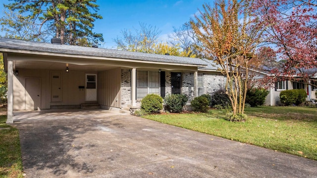 ranch-style home with a front lawn and a carport