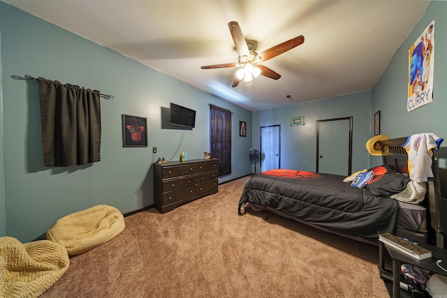 bedroom featuring light colored carpet and ceiling fan