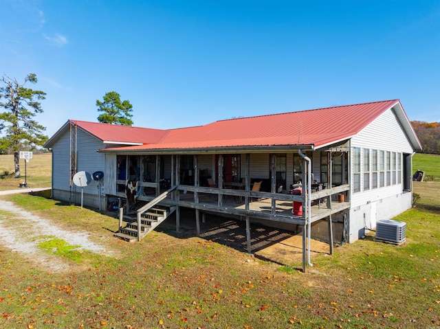 back of house featuring central AC