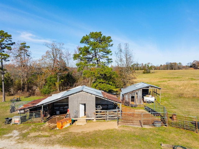 view of outbuilding with a rural view