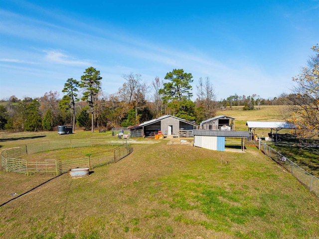 view of yard featuring a rural view and an outdoor structure