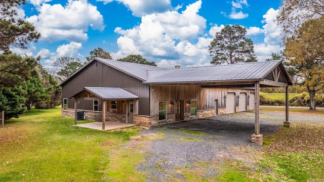 view of front of house with an outbuilding