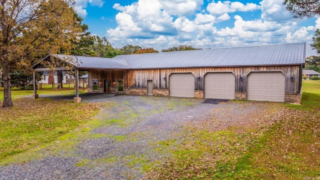 ranch-style house with an outbuilding and a garage