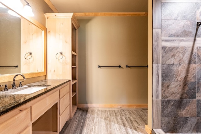 bathroom with vanity and wood-type flooring