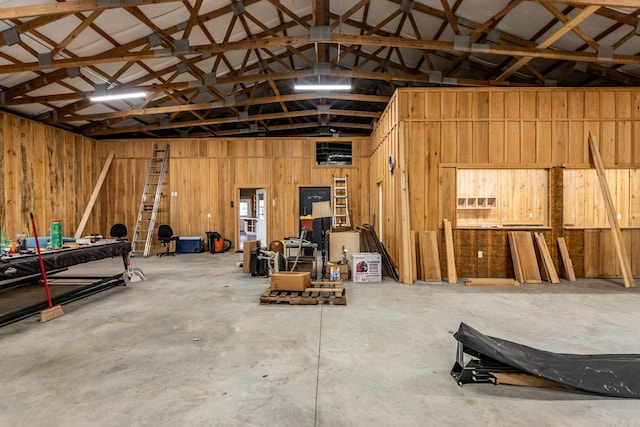 garage featuring wood walls